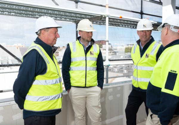 Geelong Construction team standing in a building under construction